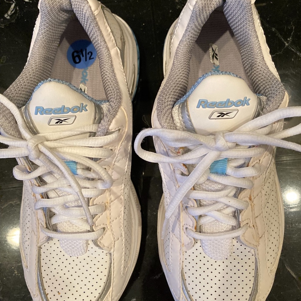 Woman’s white Reebok sneakers, 6.5